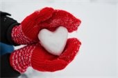 heart shaped snowball in red mittens