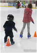Youth taking ice skating lessons