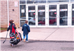 Children entering main entrance at Newington area with hockey equipment in hand