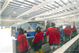 Youth hockey players in box watching zamboni ice machine resurface ice