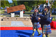 Bagpipers playing as they march by September 11, 2001 Memorial during dedication ceremony