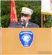 Chief Chris Schroeder standing at lectern during September 11, 2001 Memorial Dedication