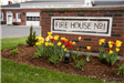 Beautiful flowers at base of sign for Company 1 firehouse