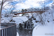 Falls at Mill Pond Park depicting snow and ice during winter