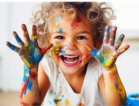 child with paint on hands
